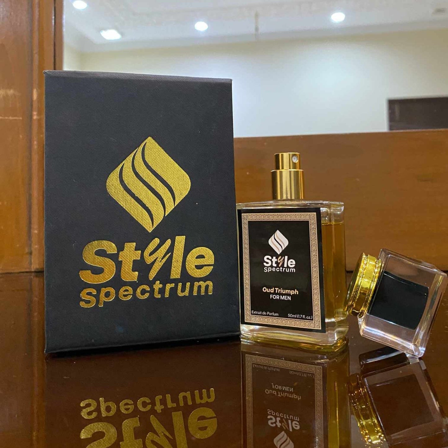 Oud Triumph perfume alongside its packaging box, ideal for office and party wear