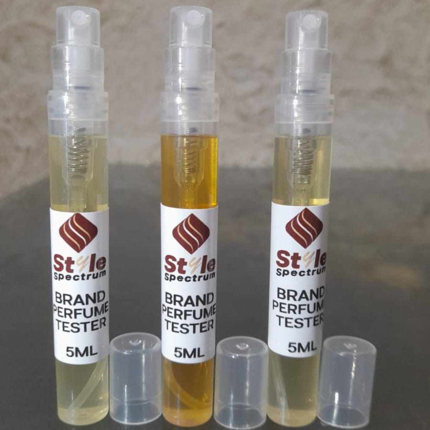 3 perfume tester set showing spray nozzle without cap, ideal for trying Amber Illumination, Oud Triumph, and Floral Essence fragrances
